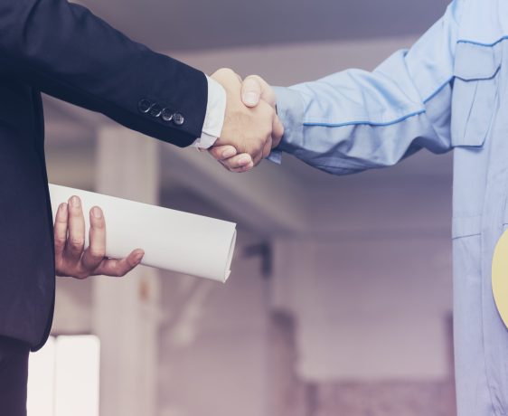 Architect engineer shaking hands with businessman on site,  Teamwork cooperation success collaboration concept